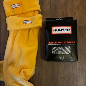 Knee high Hunter boots with two fleece liners.
